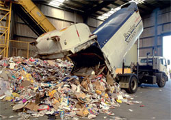 A truck unloading waste.
